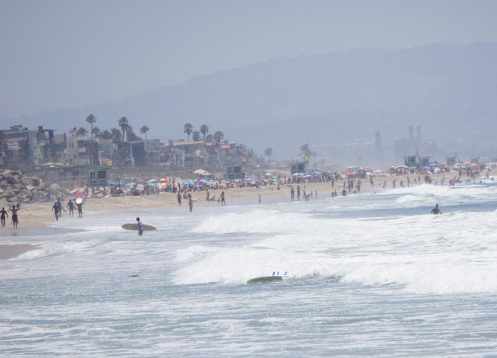 El Porto on a sunny summer day lots of surfers in the water