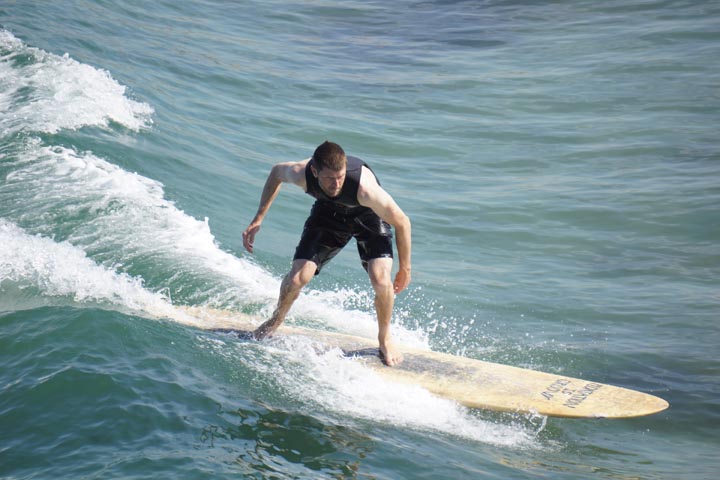 Hermosa surfer near pier first day of summer