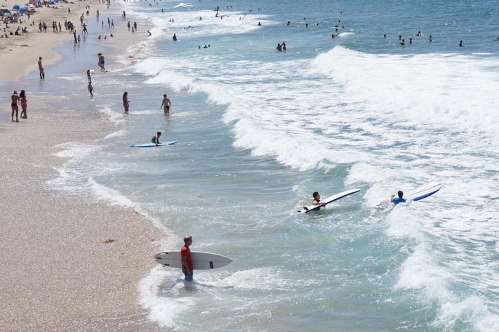 Surfers catch their last rides of summer in Hermosa on Labor Day