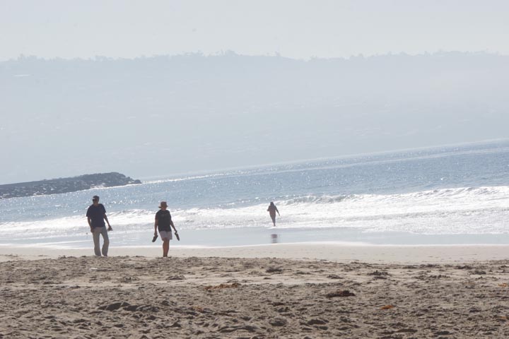 couple-walking-beach-hermosa-sunny