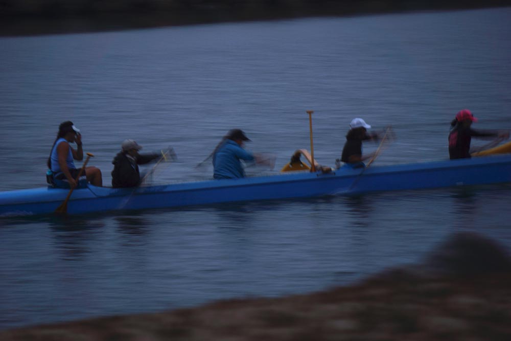 female-crew-whizzing-by-king-harbor-twilight