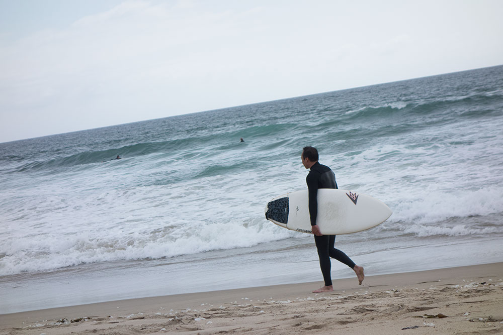 el-porto-surfer-board-walking-beach