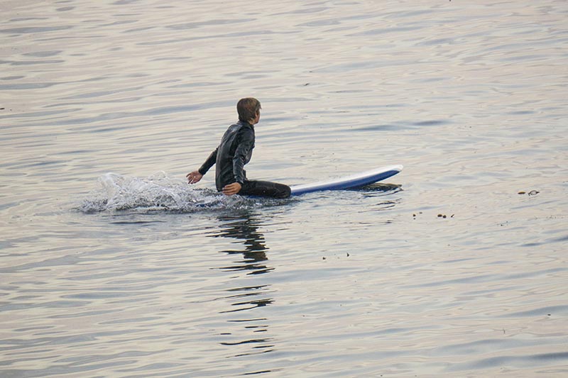 capitola-surfer-paddling