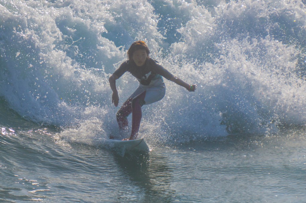 hb-surfer-backlit-wave
