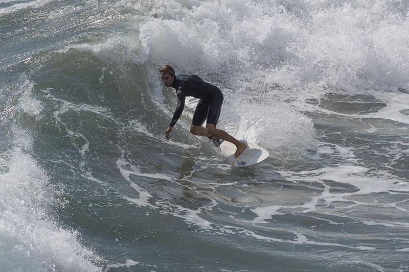 hb-surfer-surrounded-wave-sept-wed