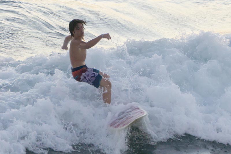 huntington-beach-surfer-leaning-back-about-fall