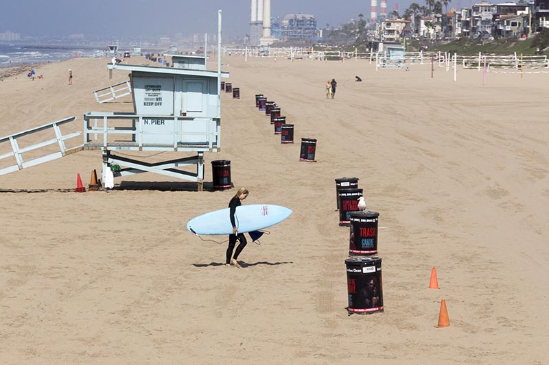 surfer-approaching-trash-mb-oct