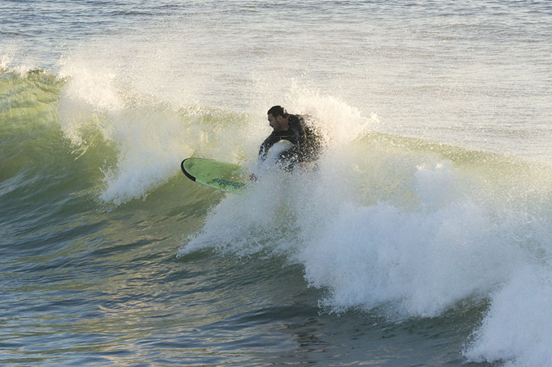 hunkered-over-surfer-mb-feb-afternoon