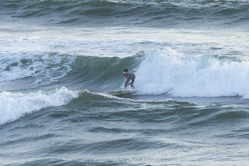 mb-surfer-near-sunset-by-pier-april