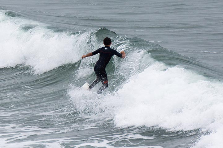 hermosa-surfer-twisting-around-may-morning