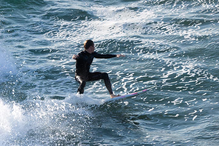 mb-rider-near-pier-june-sunny-waves