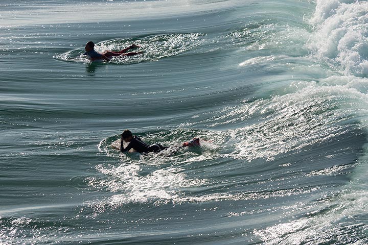 young-surfers-waiting-blue-green-ocean-north-hb-pier-june