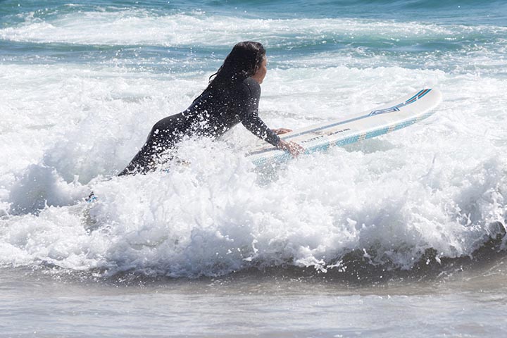 surfer-girl-diving-in-by-hermosa-pier-summer-sunday