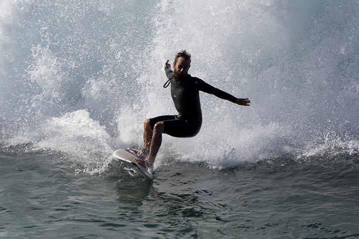 arms-wide-mb-surfer-nov-pier